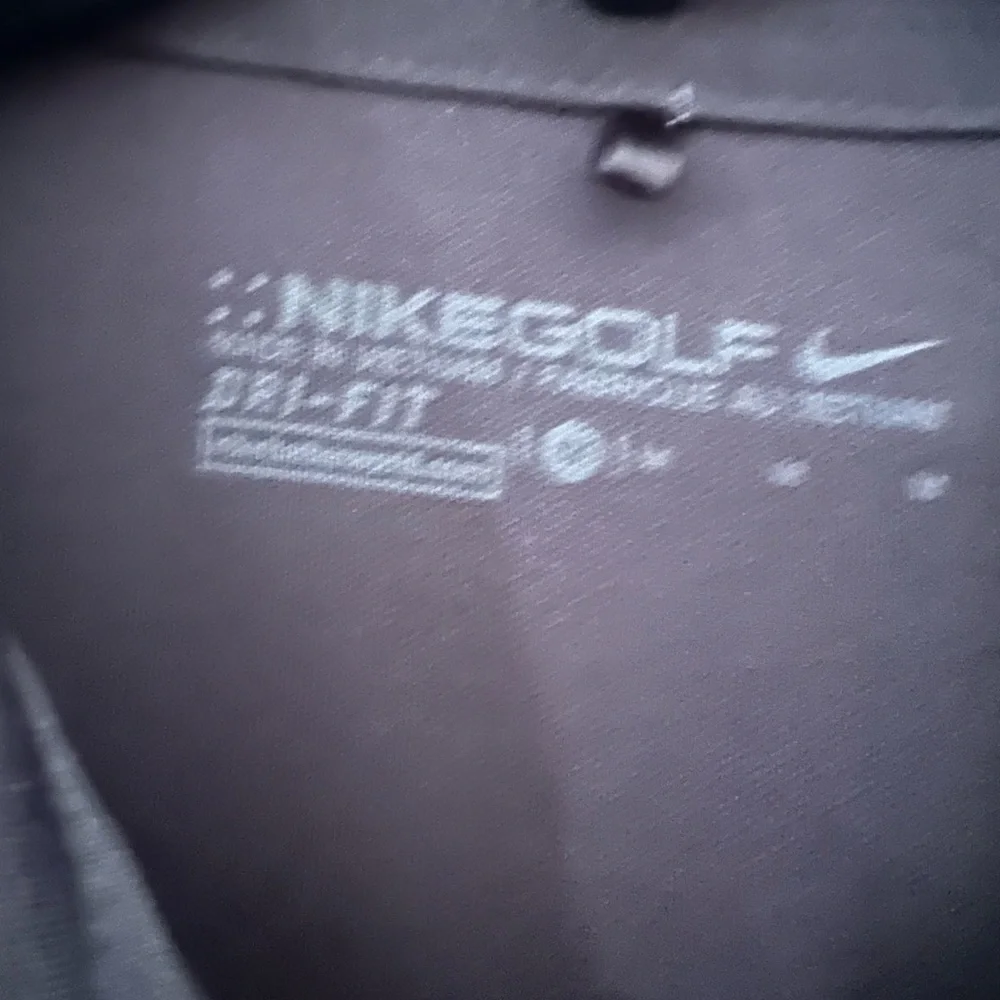 Nike Golf Dri Fit black short sleeve polo shirt. Size medium.‎